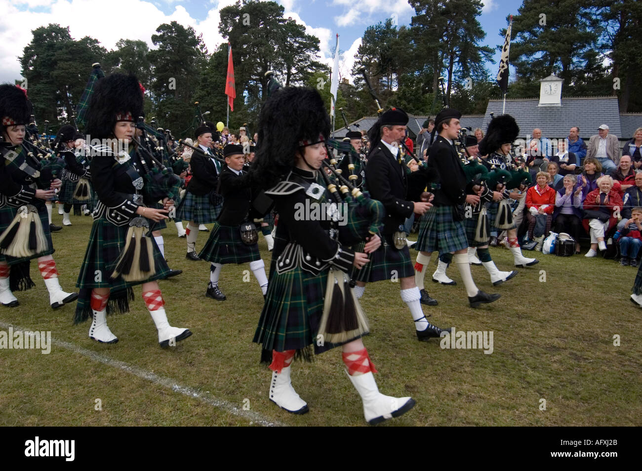 Pipe band marching at a Highland Games Stock Photo, Royalty Free Image