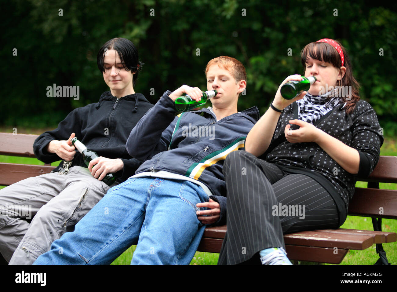 three teenagers drinking beer at a park Stock Photo 14234775 Alamy
