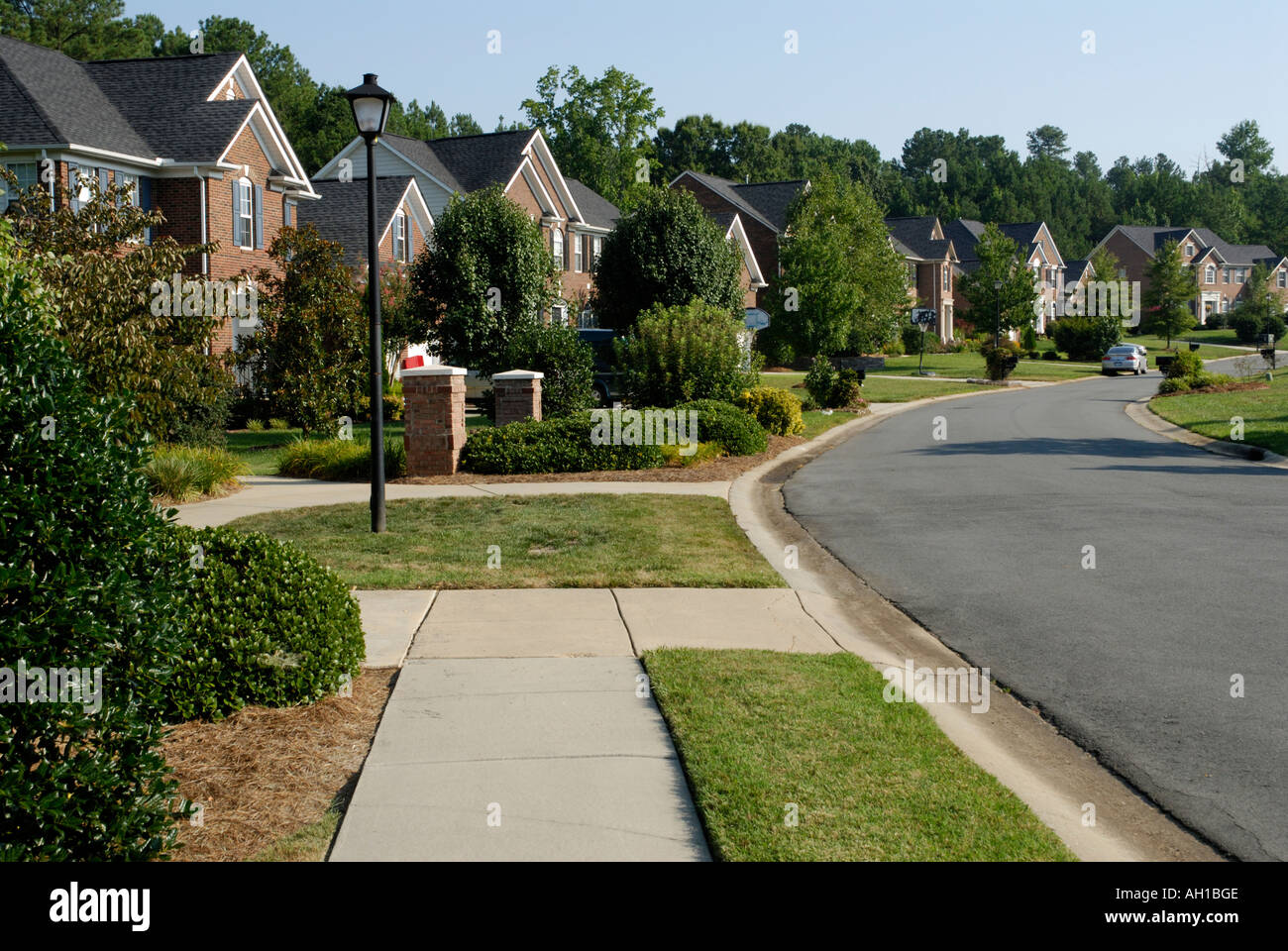 Suburban street neighborhood development with sidewalk, Charlotte, NC