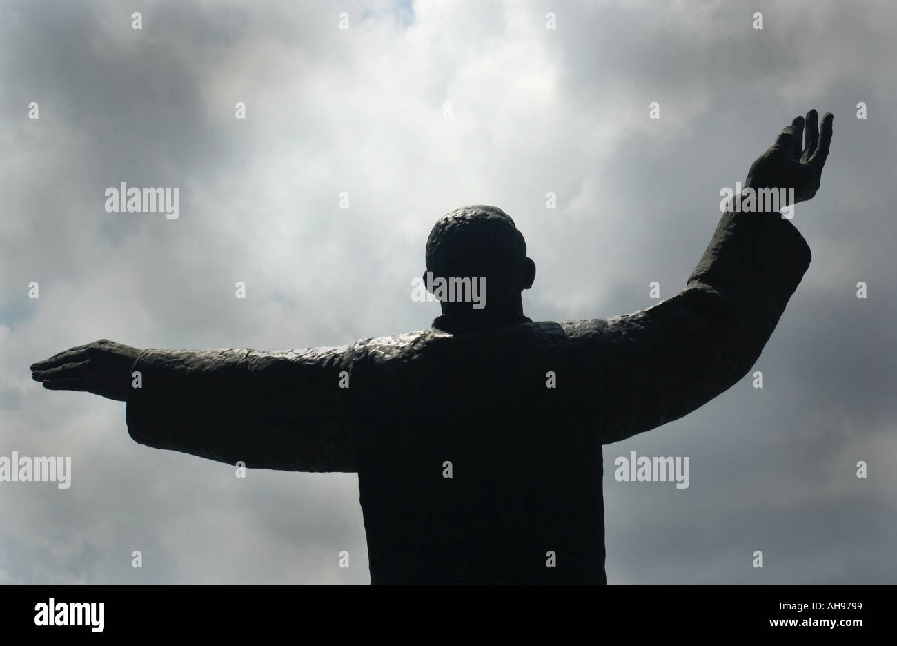 Religious Statue With Arms Outstretched Toward Sky On Display At Shrine