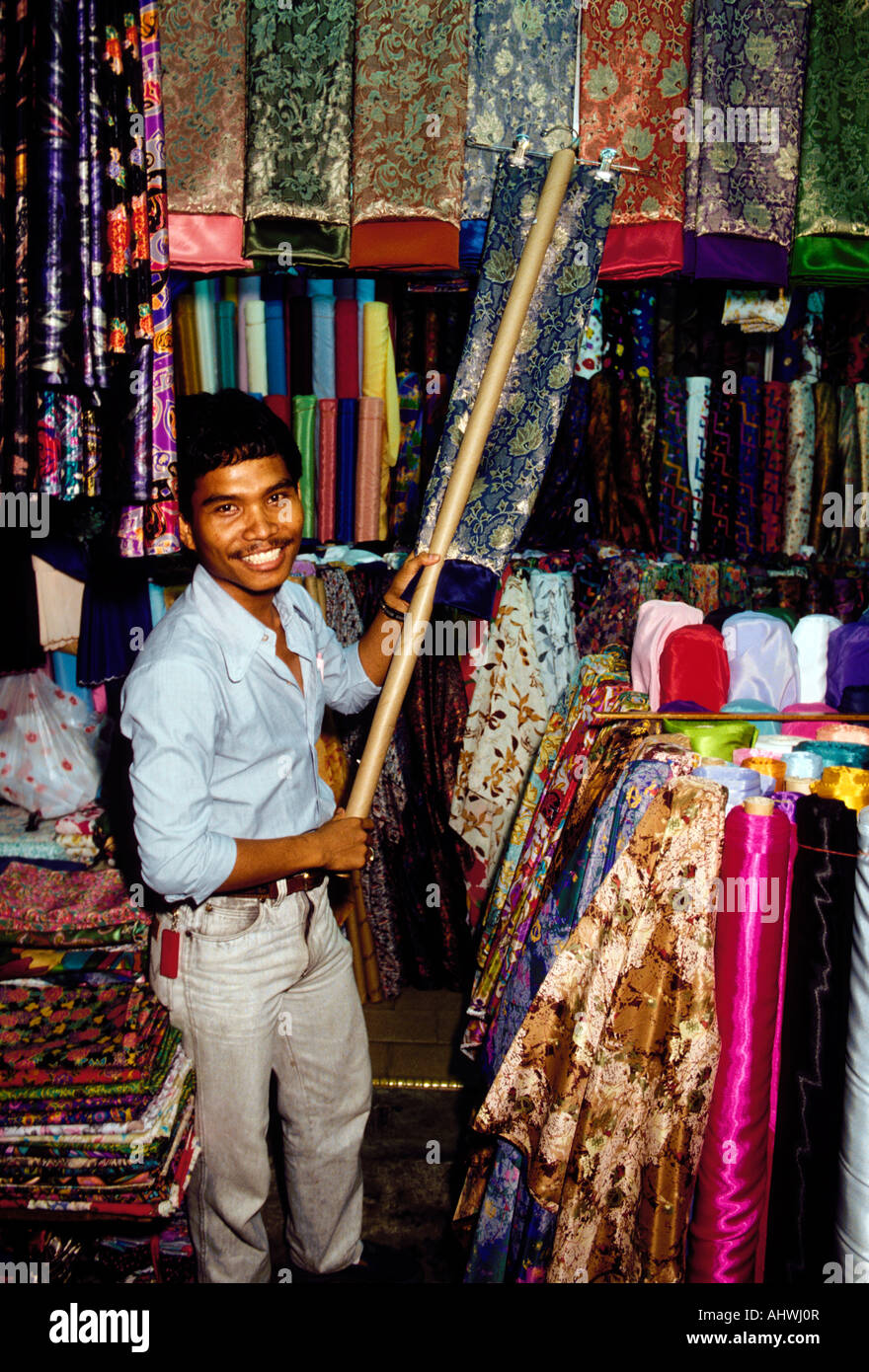 Singaporean ethnic Malay people person man male merchant selling silk