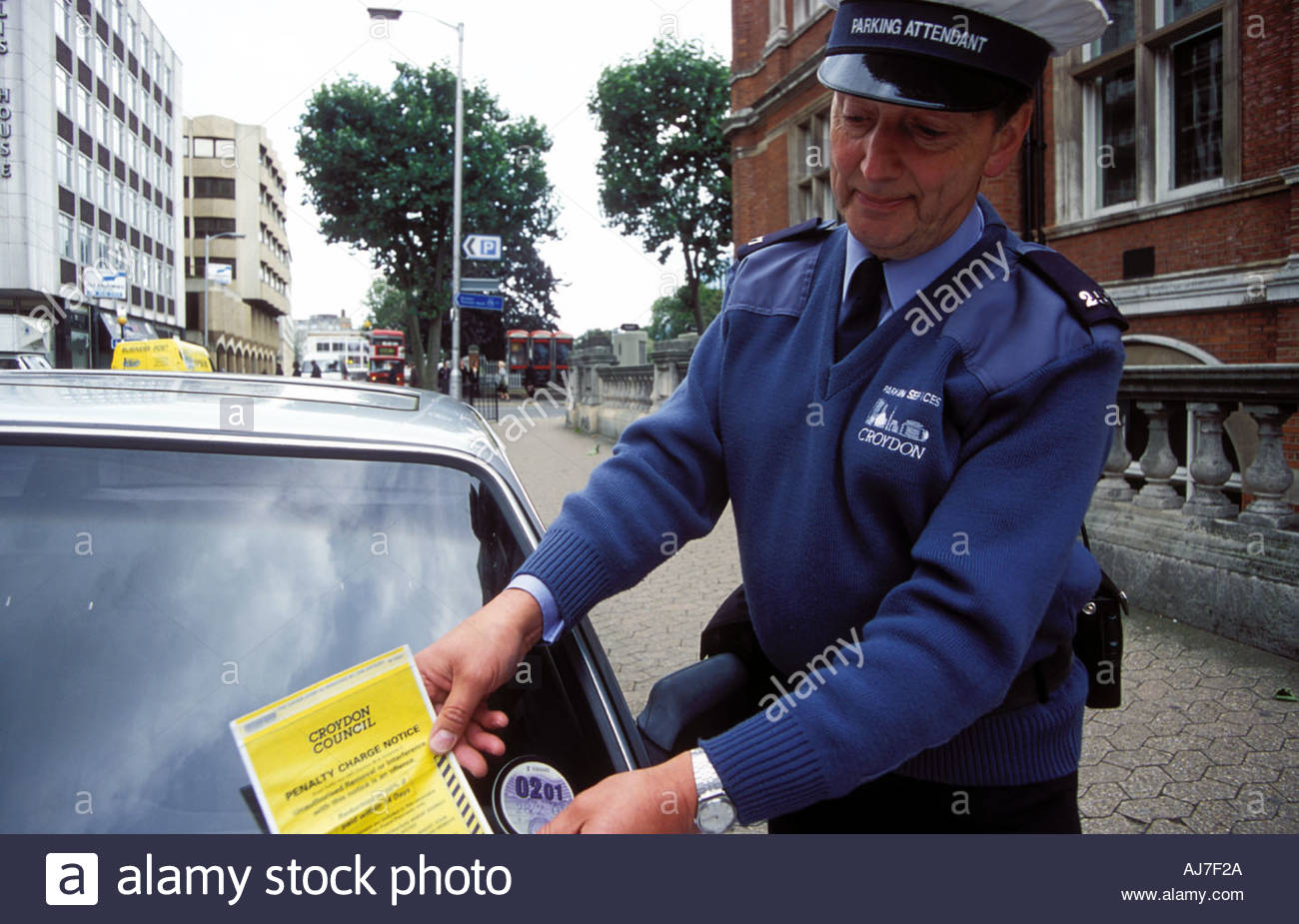 traffic-warden-putting-parking-ticket-on