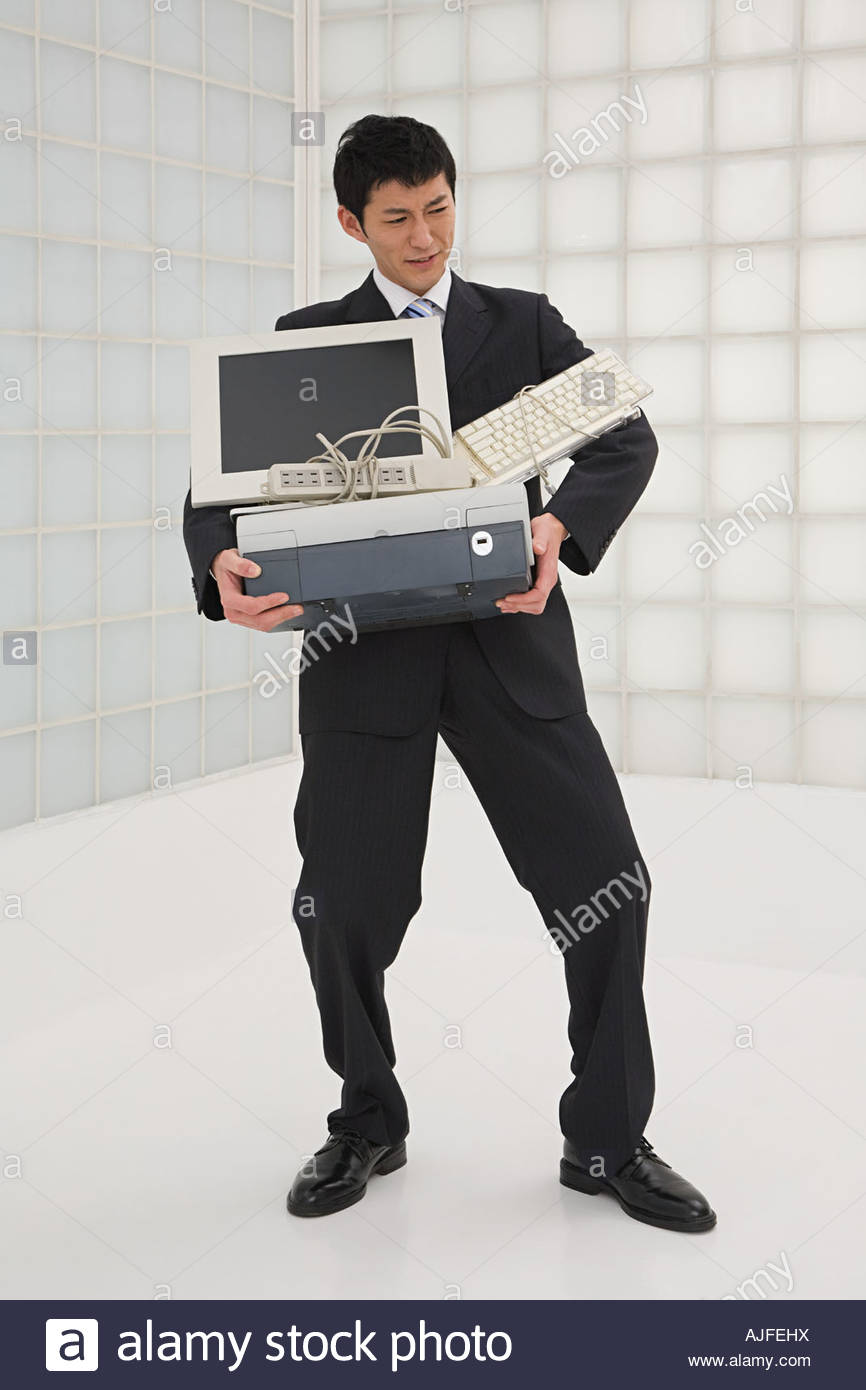Businessman carrying computer Stock Photo, Royalty Free Image 14722165