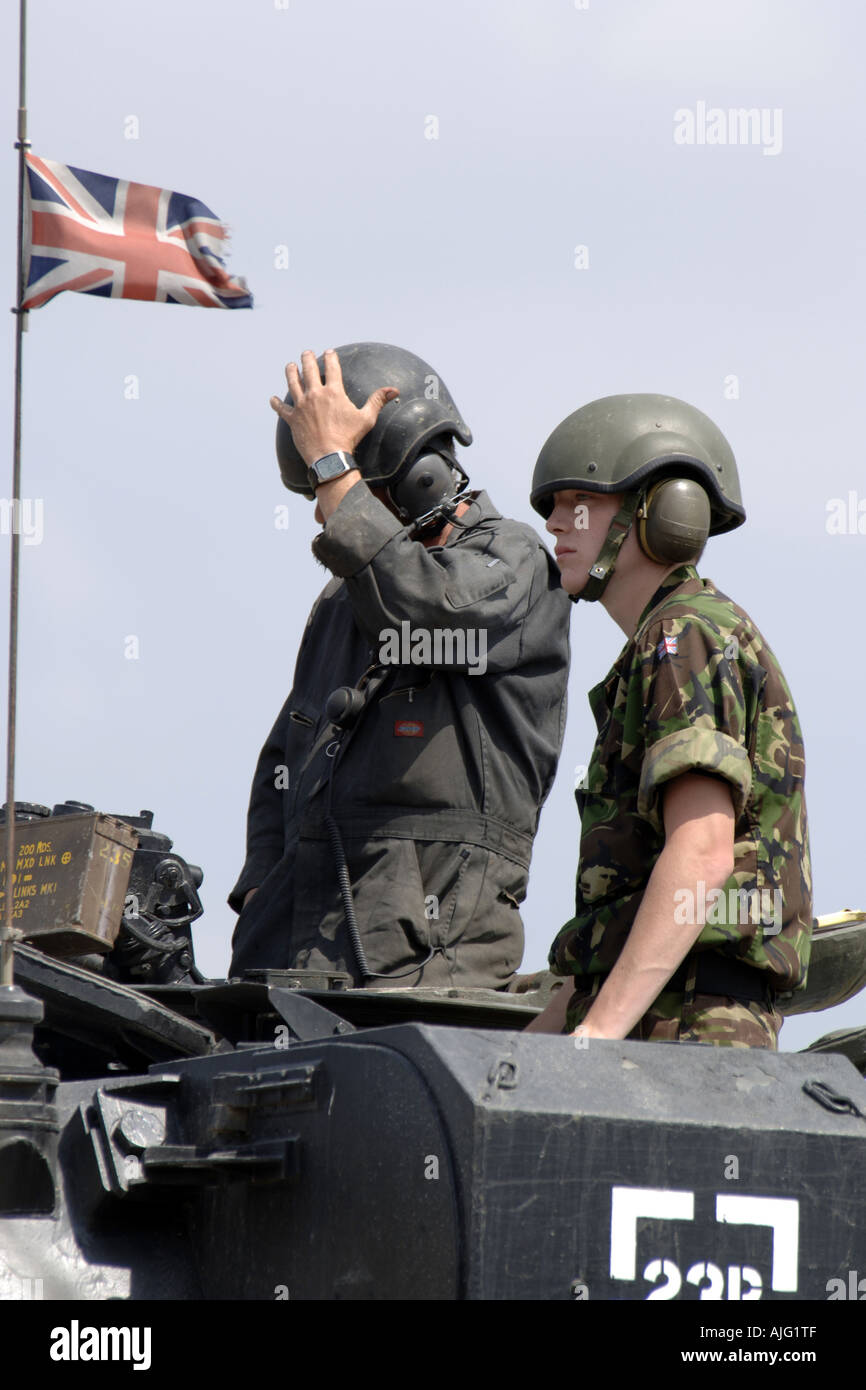 British Army Tank Crewmen standing inside a tank turret Stock Photo