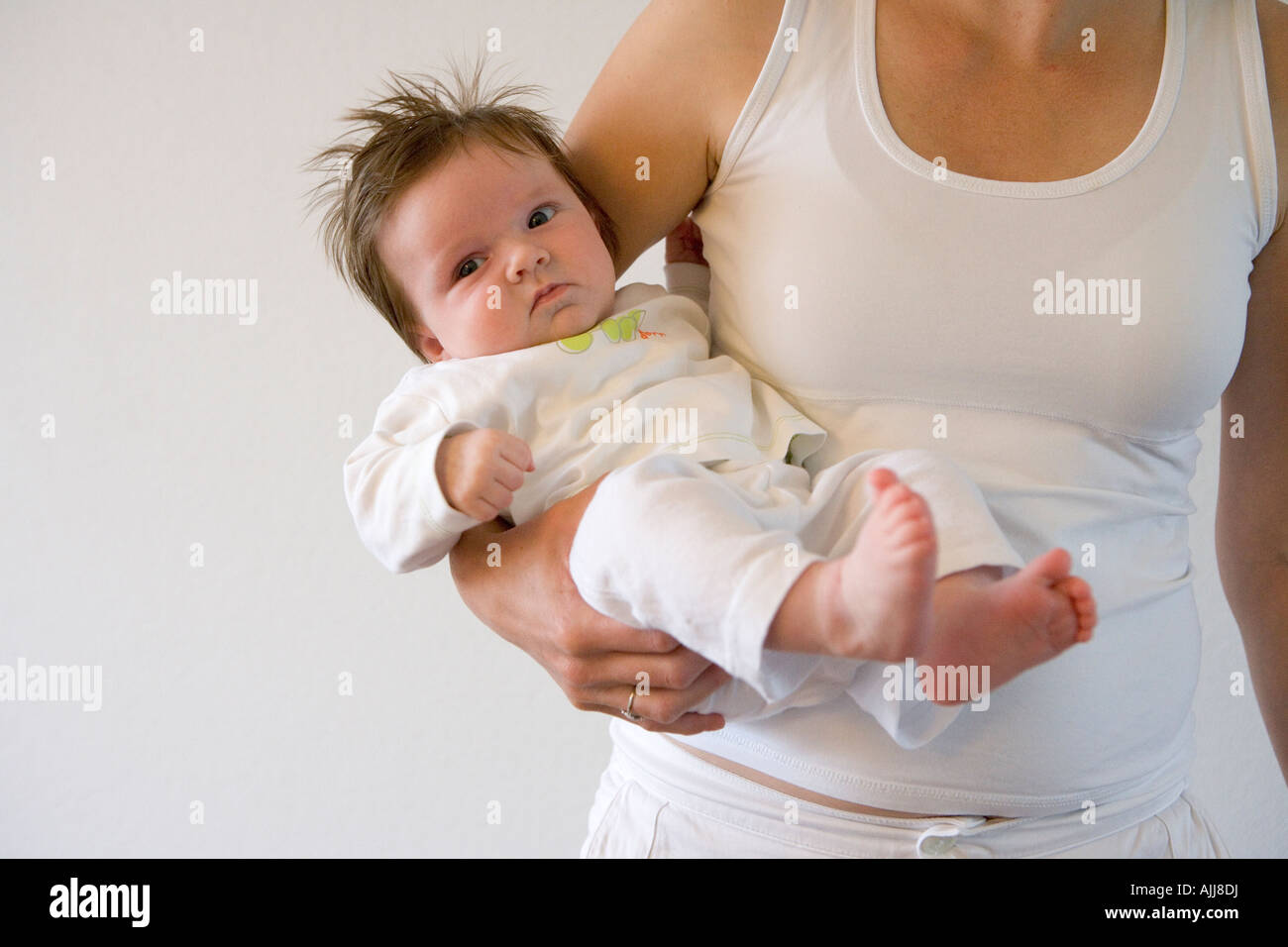 Baby With A Lot Of Hair On His Mothers Arm Stock Photo Royalty