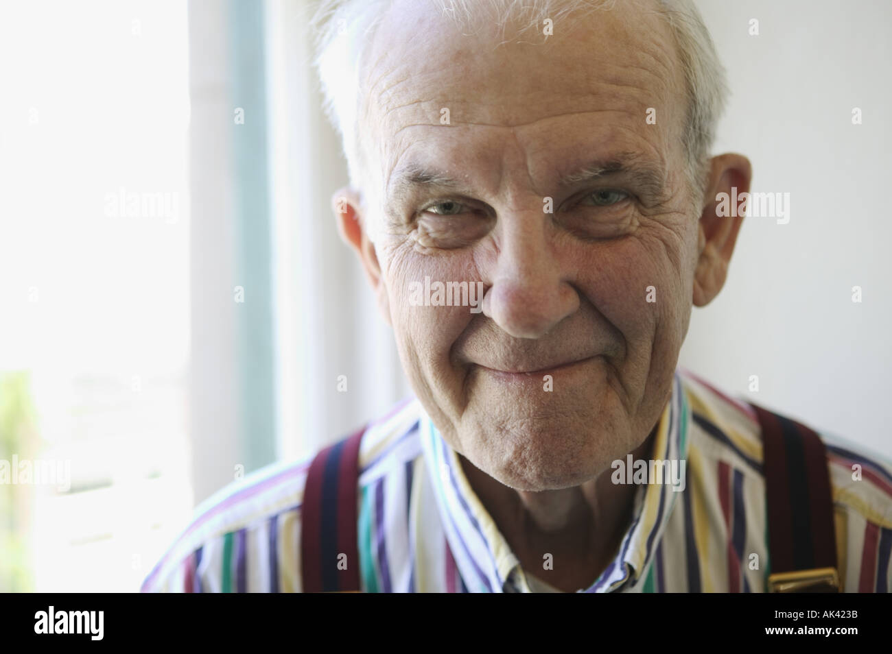 Portrait of a senior man wearing suspenders Stock Photo, Royalty Free