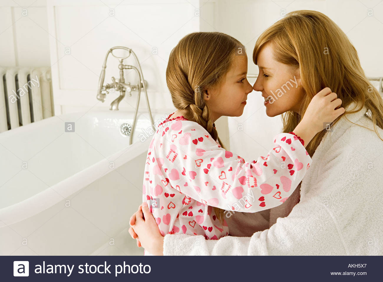 Girl and daughter rubbing noses Stock Photo, Royalty Free Image