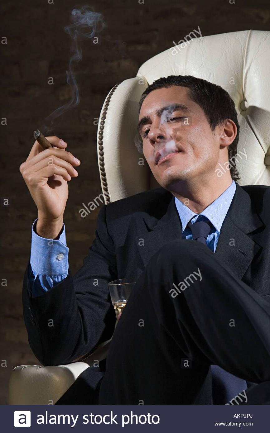 Businessman smoking cigar Stock Photo, Royalty Free Image 15052841 Alamy