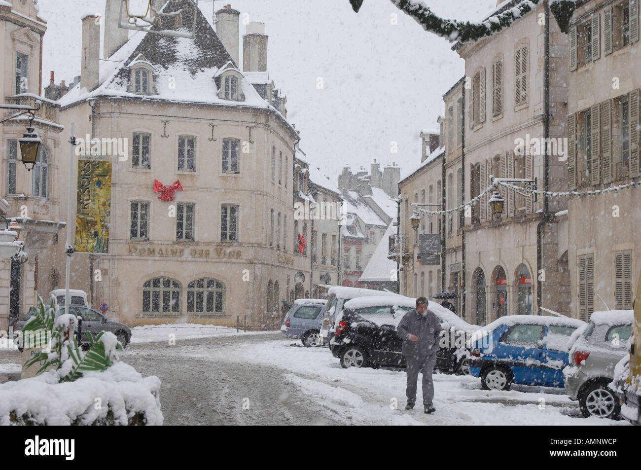 street scene with heavy snow falling in winter. Traditional french