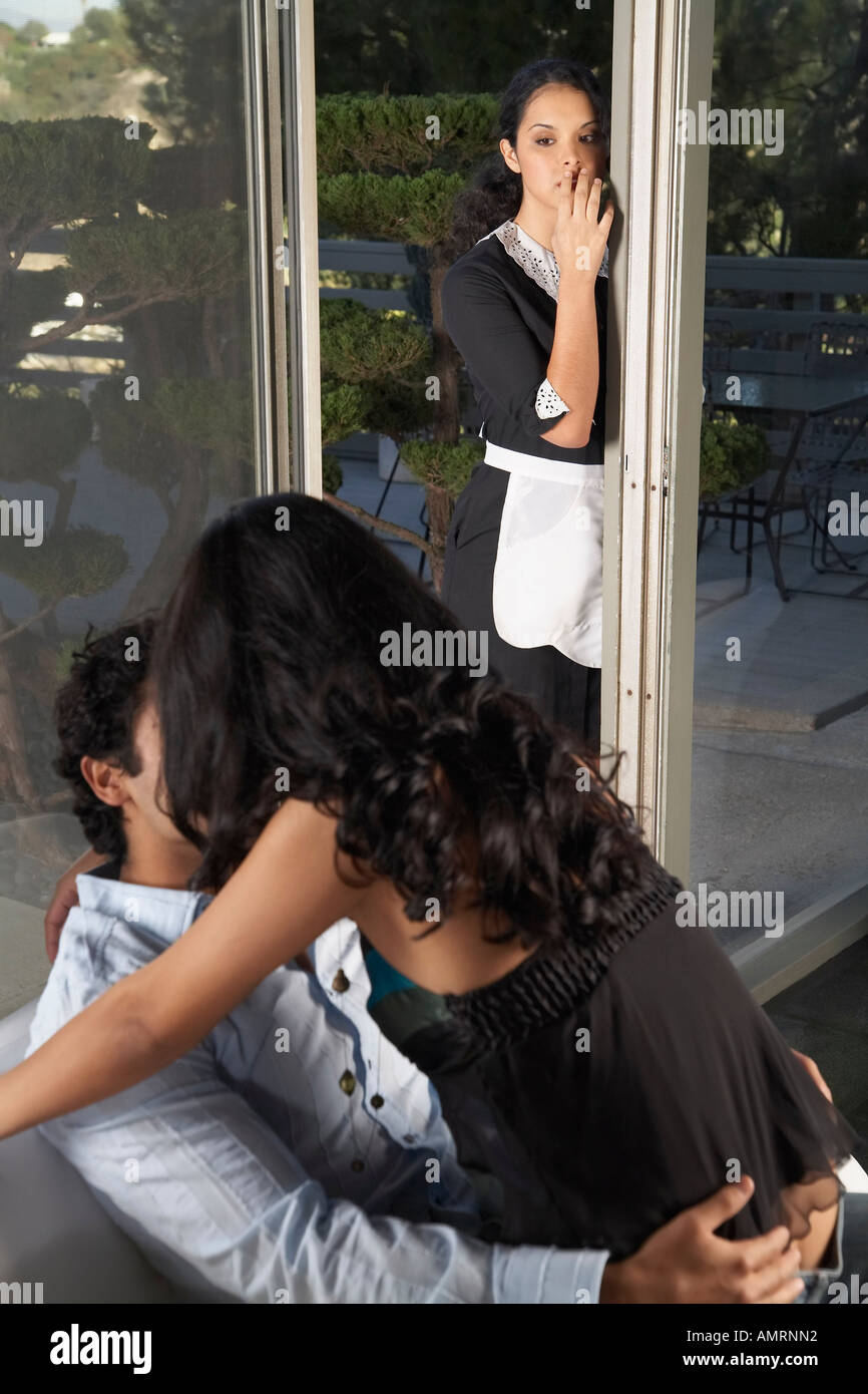 Maid Watching Couple Kiss Stock Photo Alamy