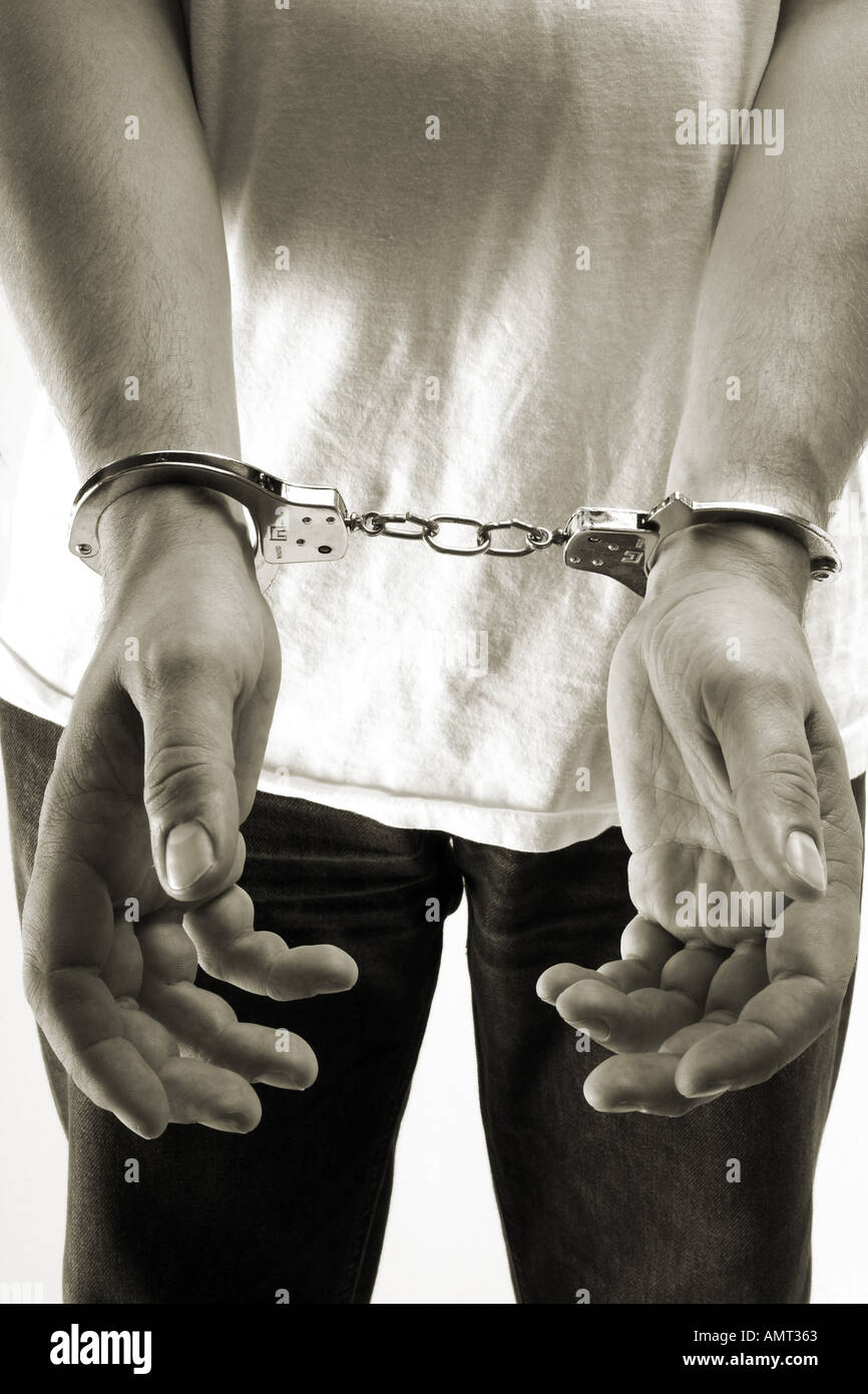 Criminal Man Arrested Wearing Handcuffs Stock Photo Alamy