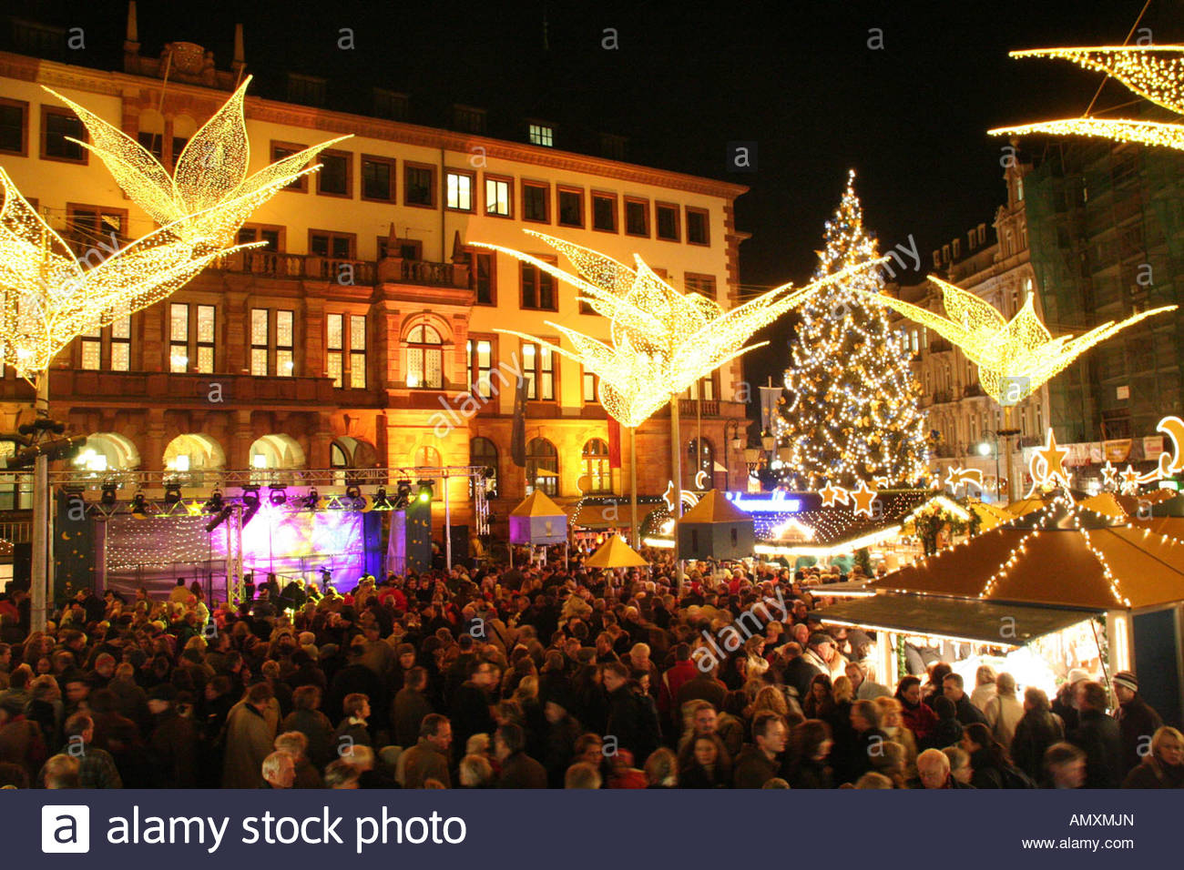 Crowd at lit up Christmas market in city Wiesbaden Germany Stock Photo, Royalty Free Image