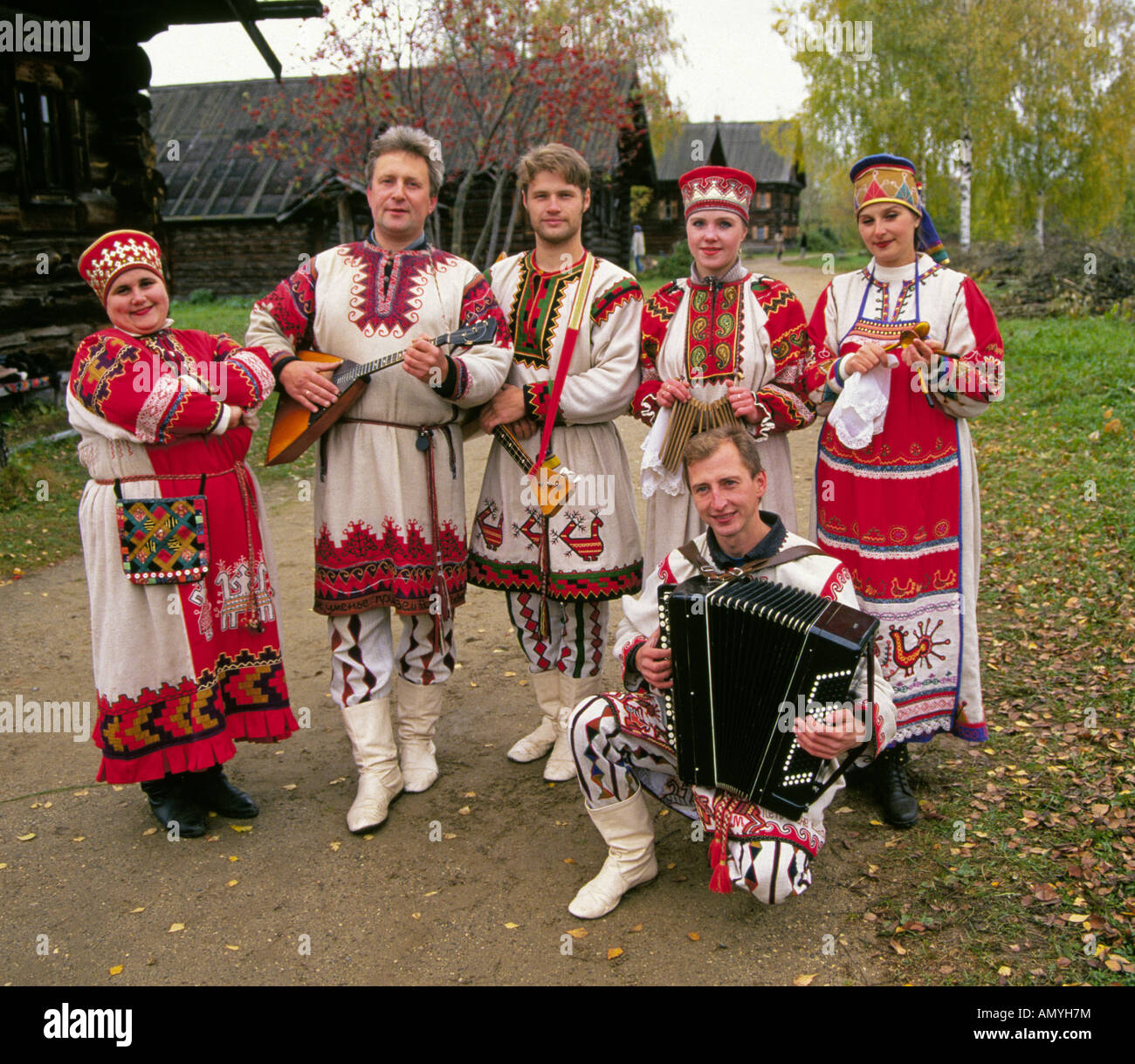 A russian folk music group in traditional clothing in a small remote A russian folk music group in traditional clothing in a small remote
