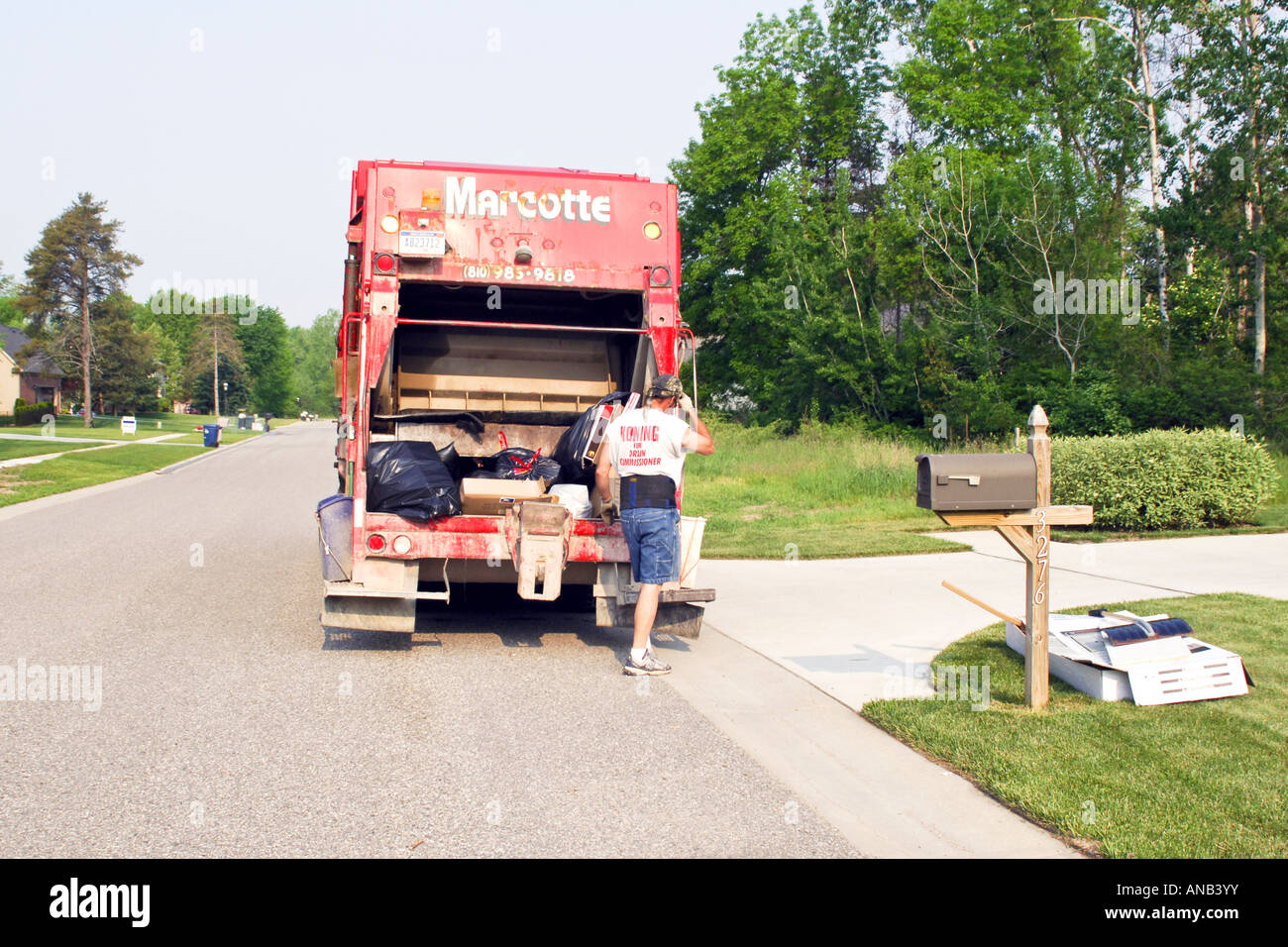 Local Neighbourhood rubbish collection workers pick up household Stock