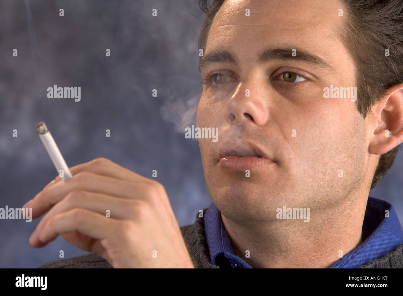 A Man Smoking A Cigarette Stock Photo Alamy