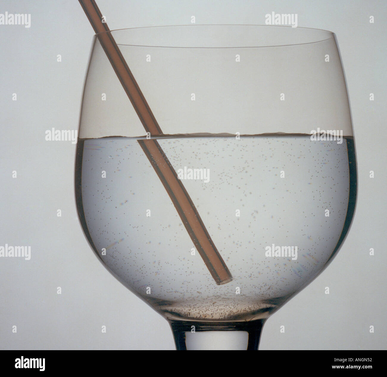 Refraction of a straw in a glass of water Stock Photo, Royalty Free