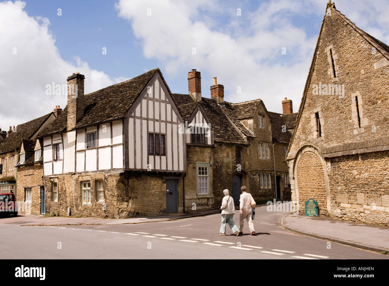 UK Wiltshire Lacock village High Street medieval Tithe Barn at East