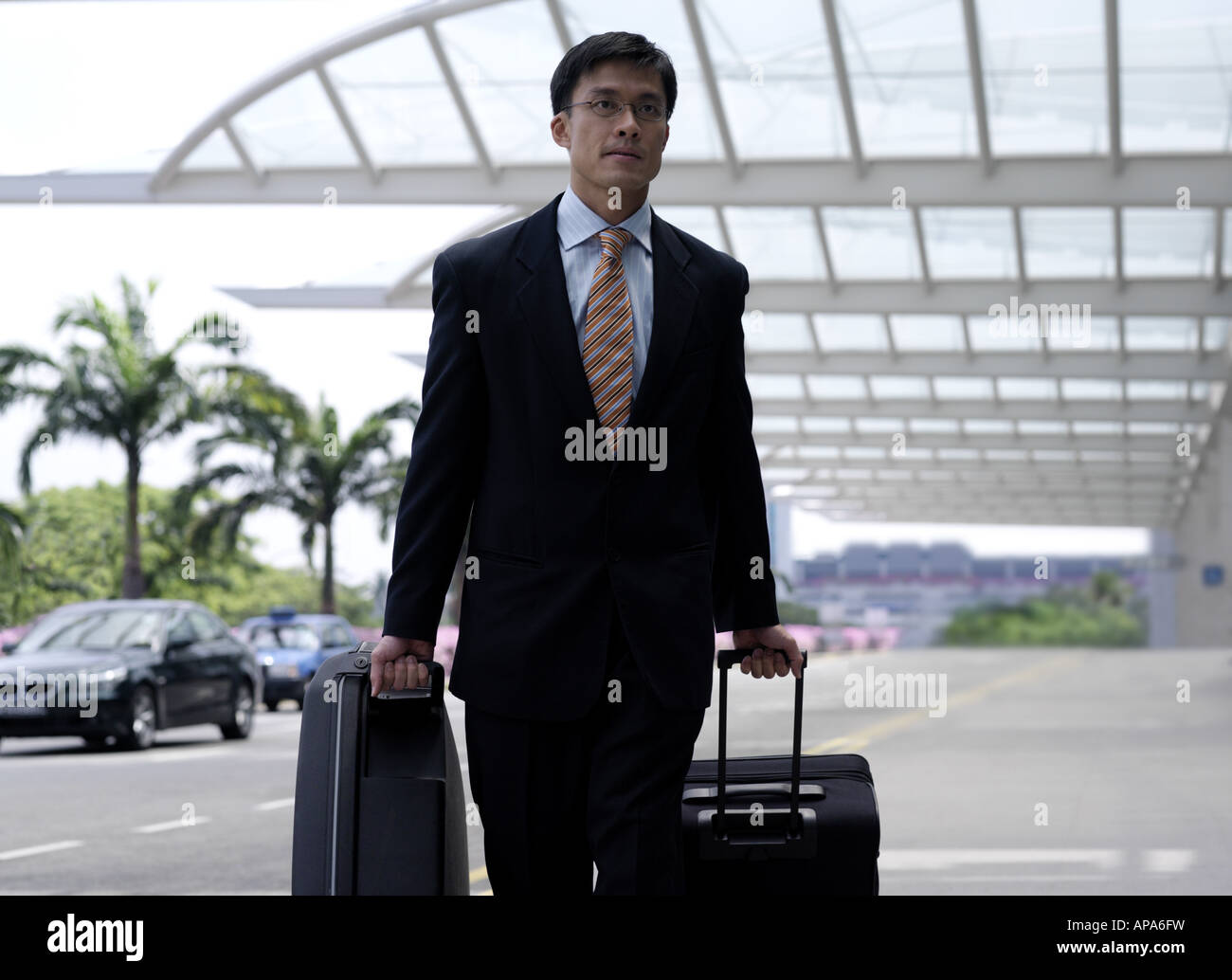 Businessman Walking With Luggage Stock Photo Alamy