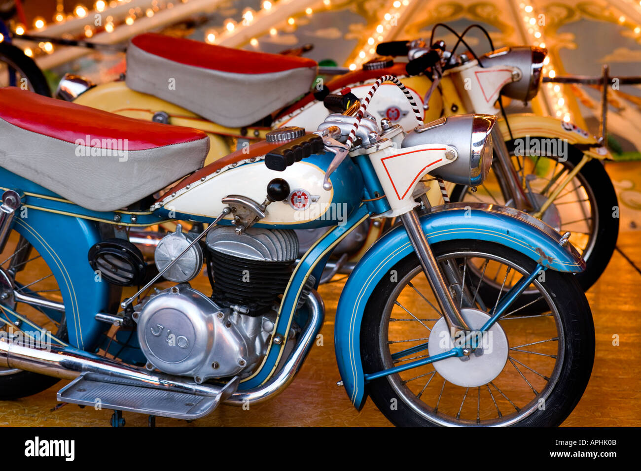 stock photo vintage small childrens size motorcycles on a merry go round empty fairground in haarlem holland waiting for customers - Small Childrens Images stock photo vintage small childrens size motorcycles on a merry go round empty fairground in haarlem holland waiting for customers - Small Childrens Images