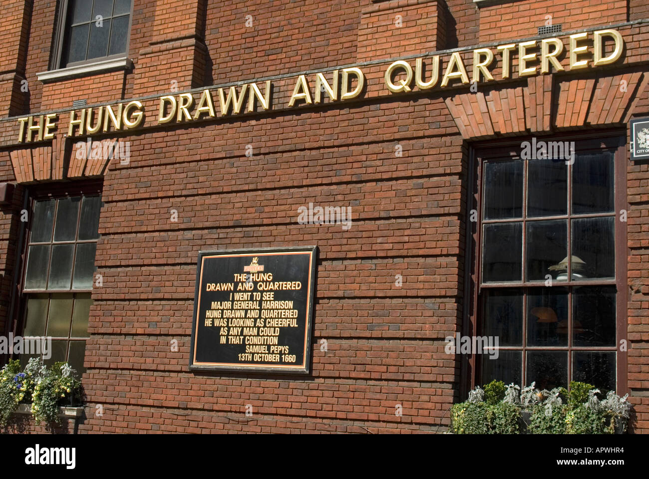 The Hung Drawn and Quartered pub at Tower Hill with wall mounted Stock Photo, Royalty Free Image