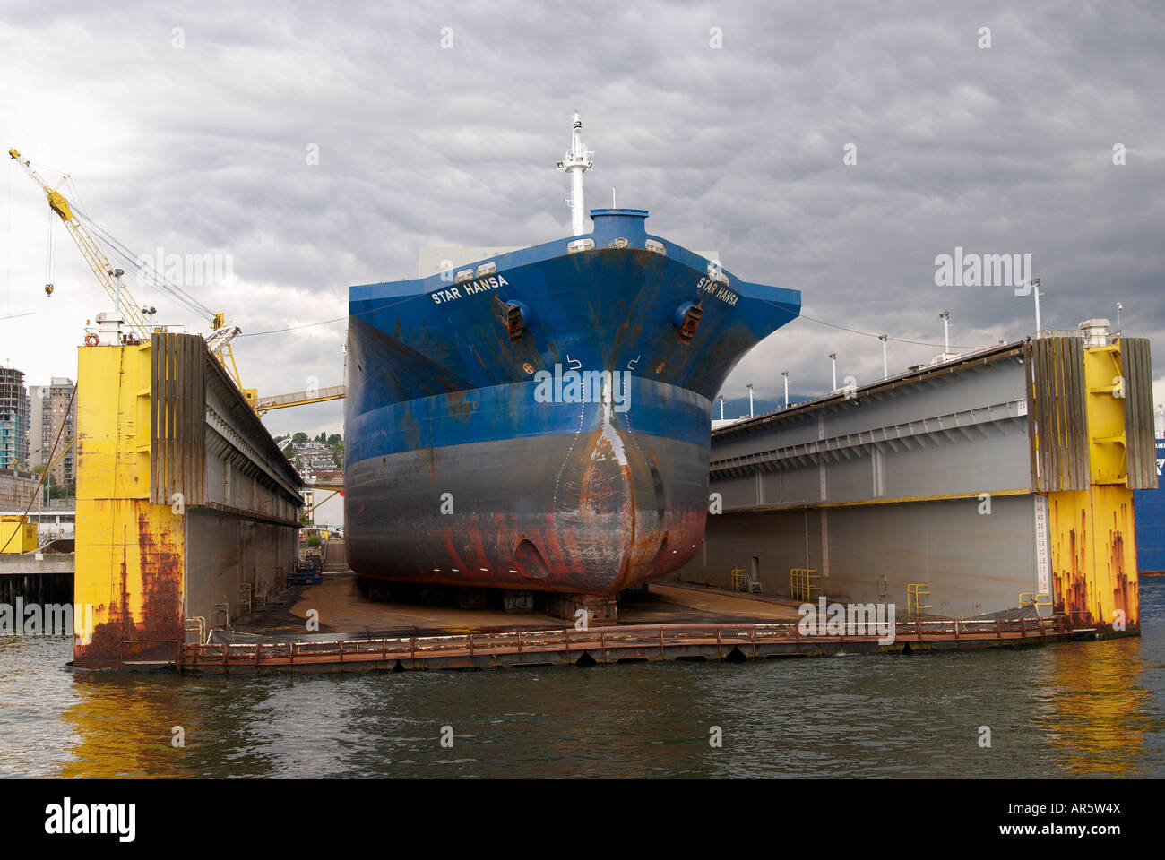Ship in floating dry dock at a shipyard in North Vancouver Stock Photo