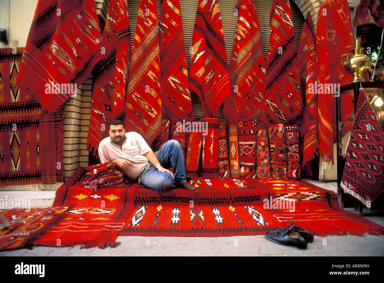 Carpet seller in bazaar, Bagdad, Iraq Stock Photo, Royalty Free Image