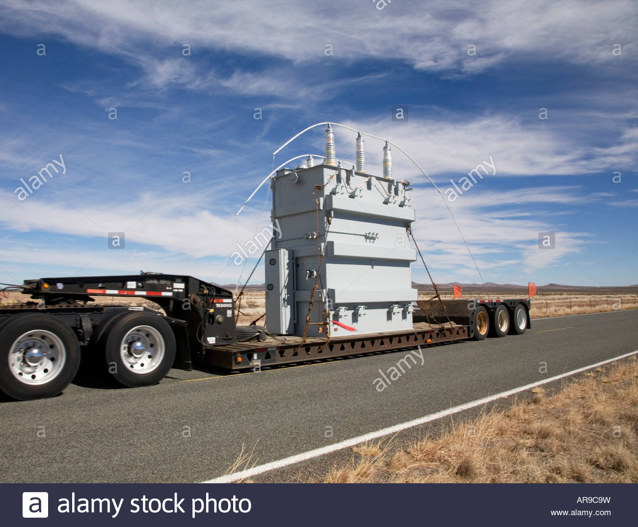 Truck hauling wide load oversize load over size load wideload Stock