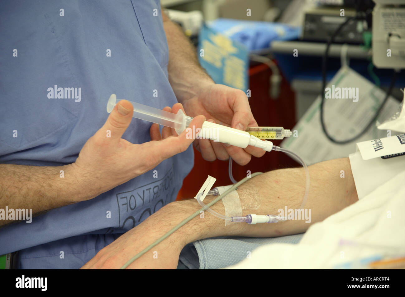An anaesthetist administering intravenous propofol, or Diprivan, to