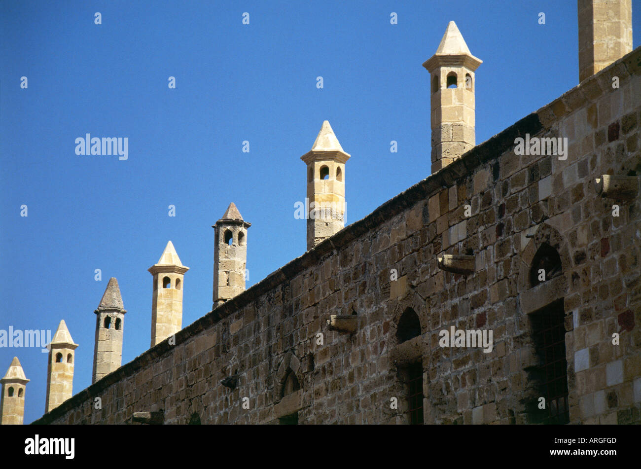 Some Of The Octagonal Chimneys Topped With Pointed Pyramidal Caps