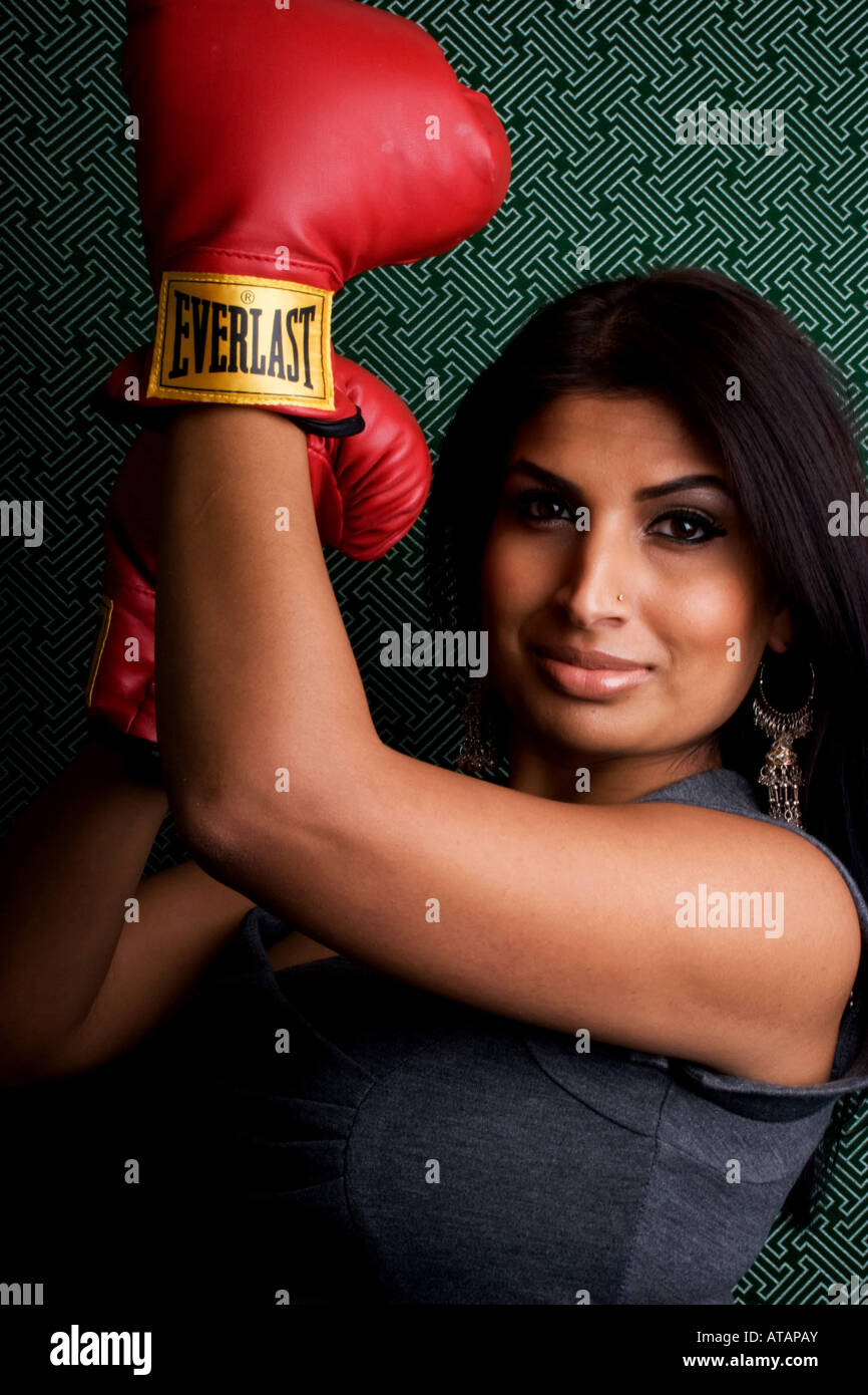INDIAN WOMAN WEARING BOXING GLOVES Stock Photo, Royalty Free Image
