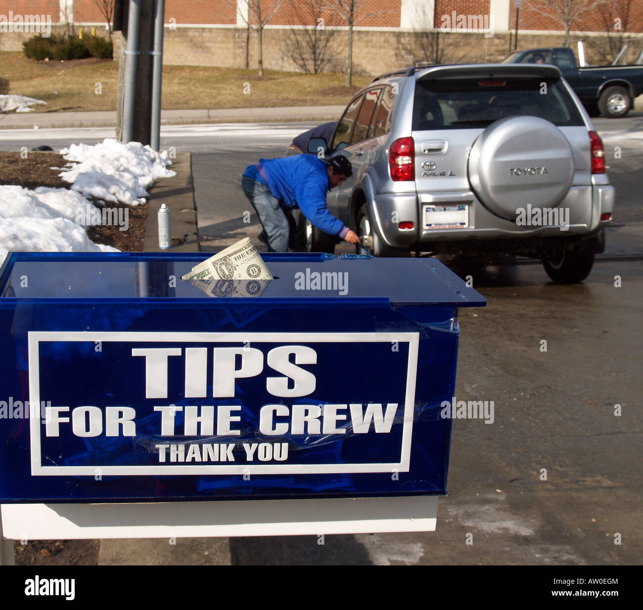 Tip box for workers at a car wash Stock Photo, Royalty