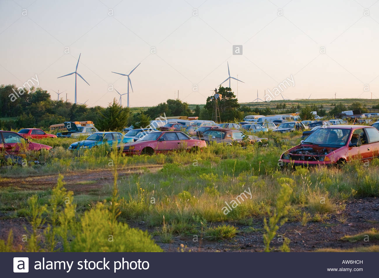 Windfarm next to an auto salvage yard near Weatherford, Oklahoma USA