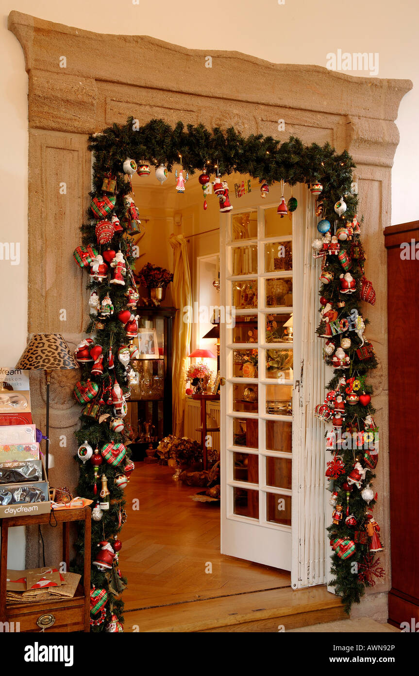 Livingroom doorway decorated with Christmas garland Stock Photo