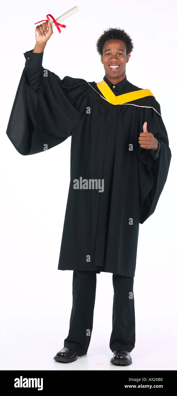 Young Man Wearing Graduation Gown Uid 1448348 Stock Photo, Royalty ...