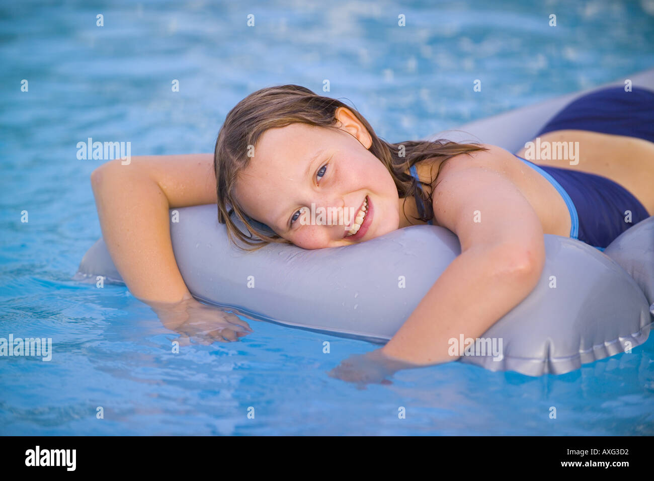 SPAIN 10 YEAR OLD GIRL CHILD FEMALE LYING ON LILO INFLATABLE