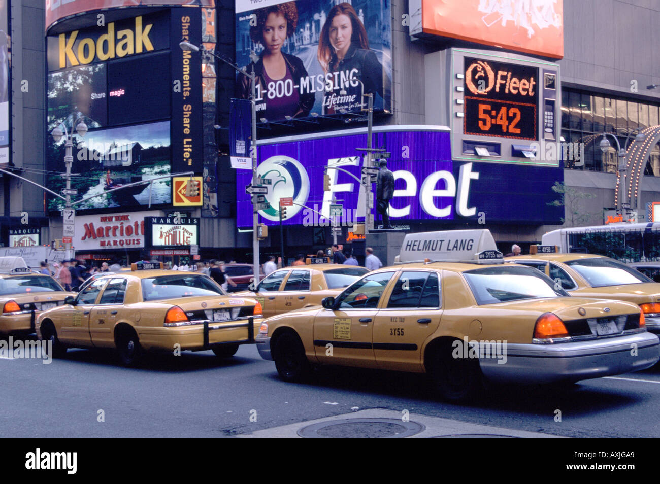 new-york-taxi-cabs-in-time-square-AXJGA9