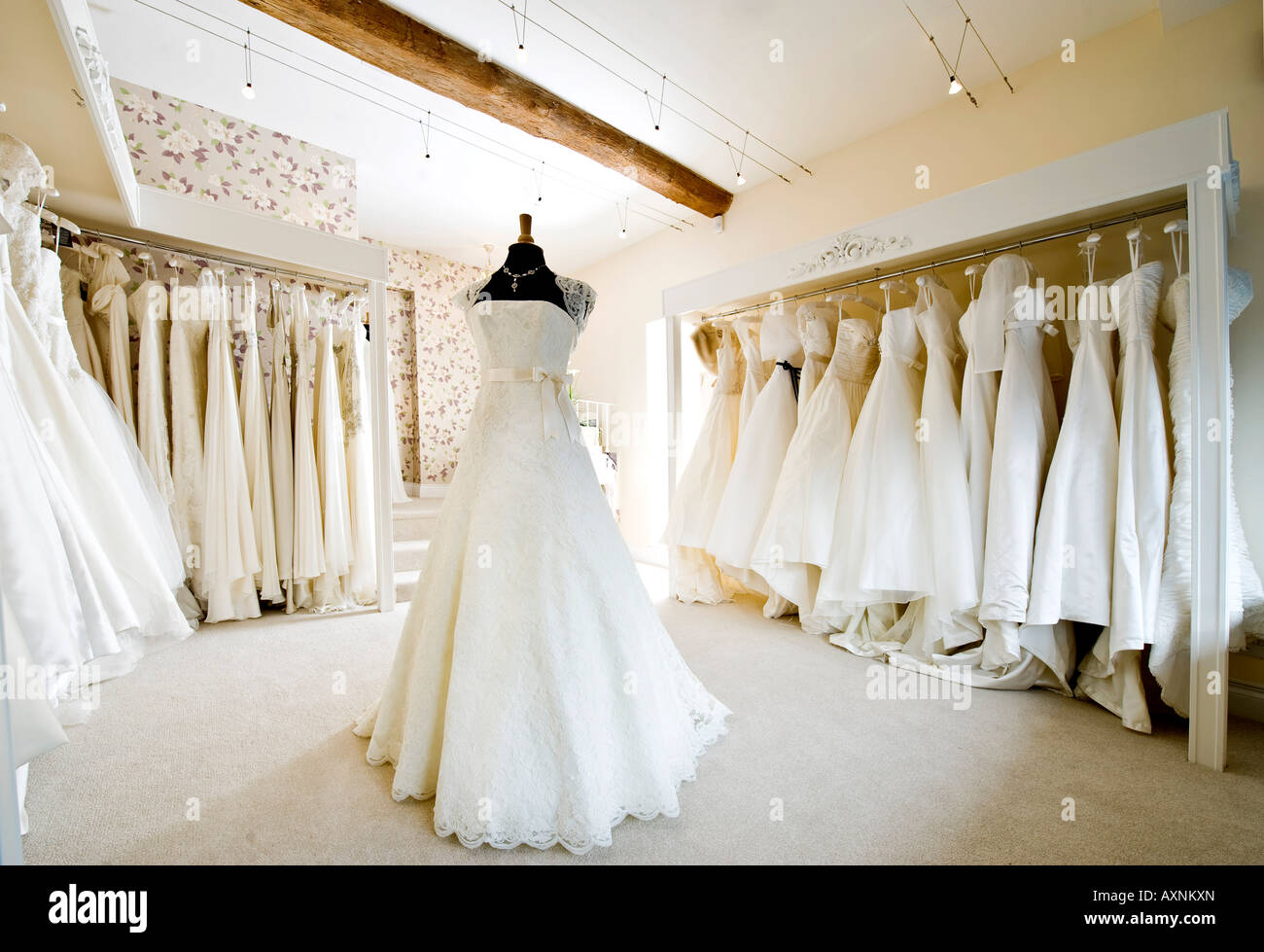 interior of wedding dress gown in bridal boutique shop 