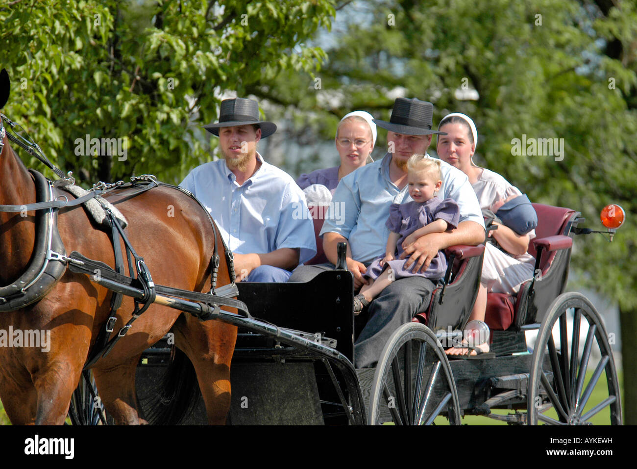 Amish people go about their business in Shipshewana Indiana Stock Photo