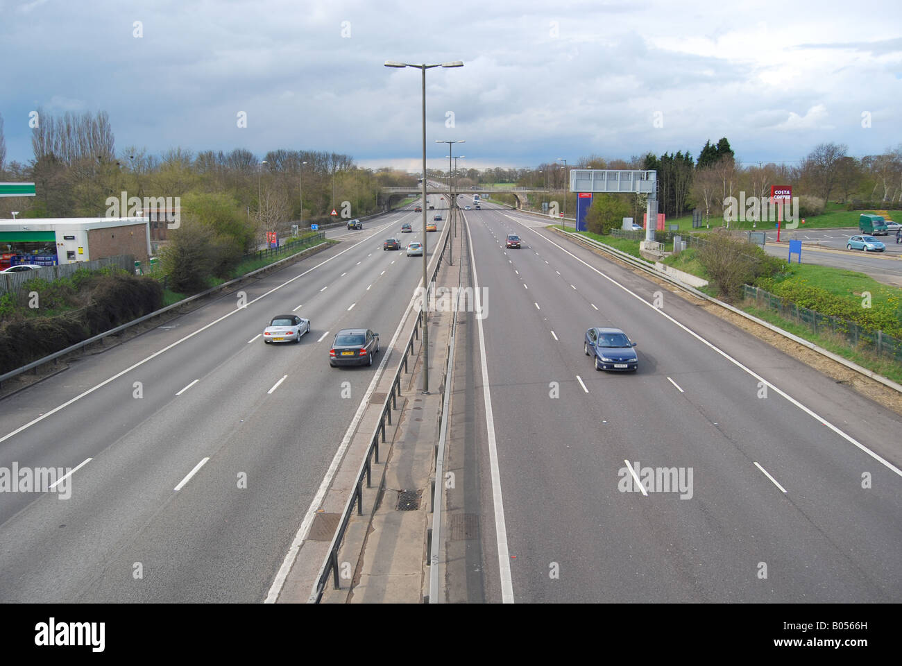 M1 motorway cars coach lorries fast lane stormy sky Stock Photo