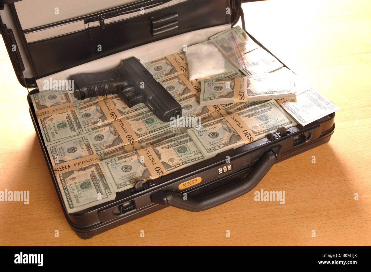 a-briefcase-full-of-money-with-a-gun-and-some-drugs-in-it-replics-B0MTJX.jpg