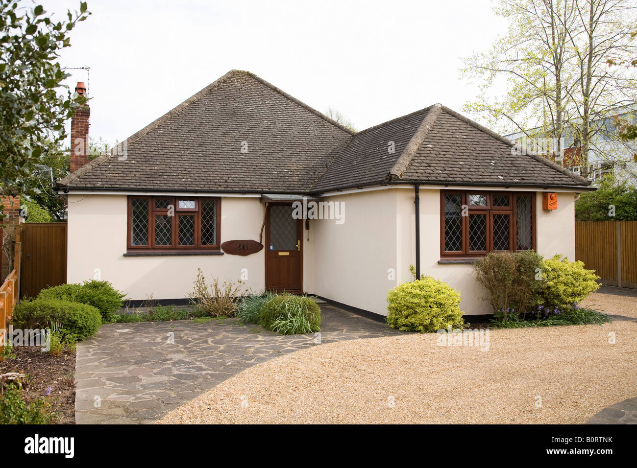 Bungalow home with gravel driveway in Addlestone, Surrey Stock Photo