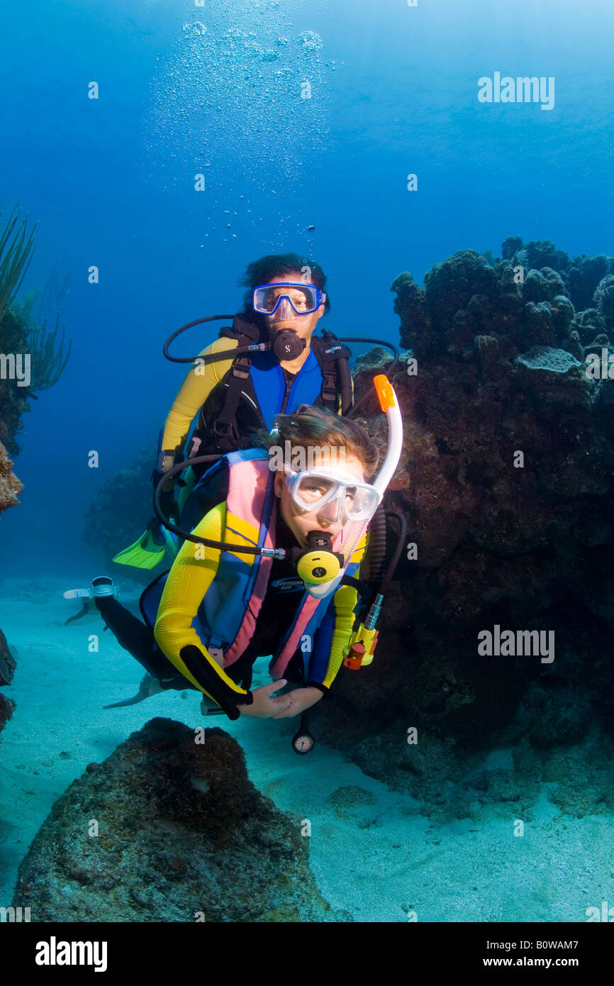 Mother and daughter scuba diving, Roatan, Honduras, Caribbean Stock