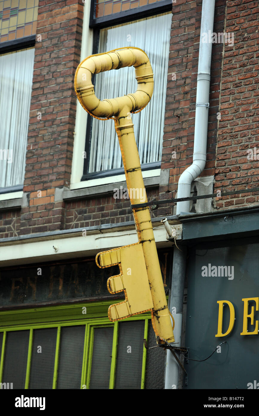 Larger than life size model of a front door key, bracketed to a ... Larger than life size model of a front door key, bracketed to a ...