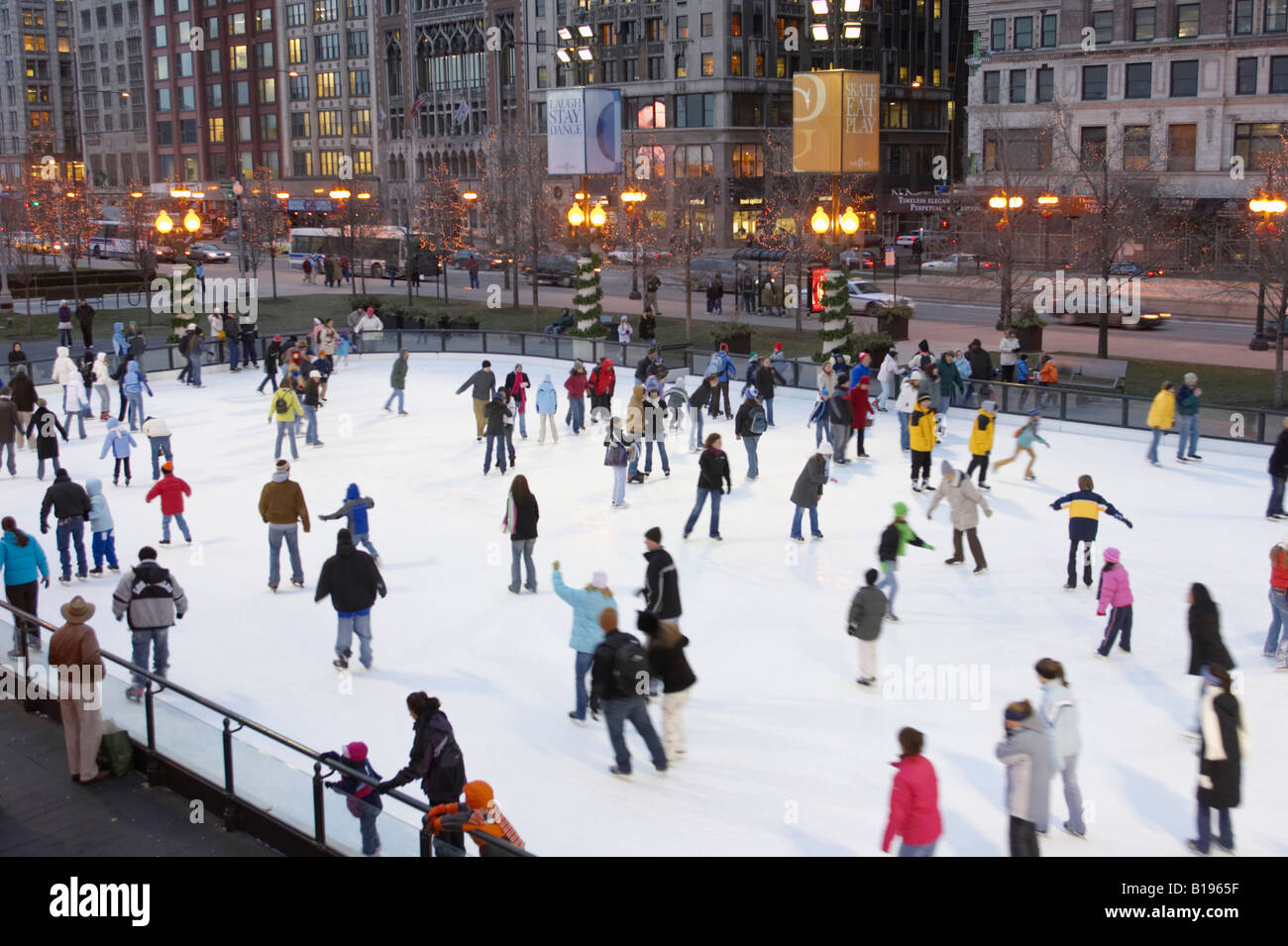 SKATING Chicago Illinois Ice skaters at Millennium Park ice rink Stock