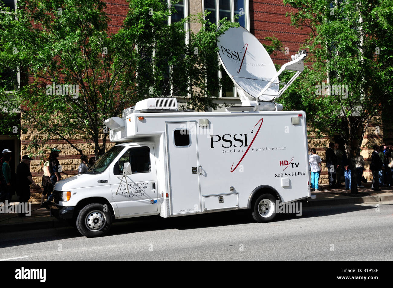 Uplink satellite communications transmission dish on a mobile TV Stock