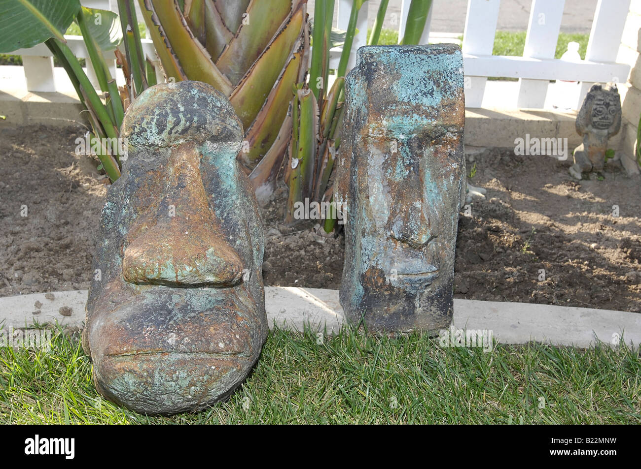 Concrete Tiki Heads Stock Photo Alamy