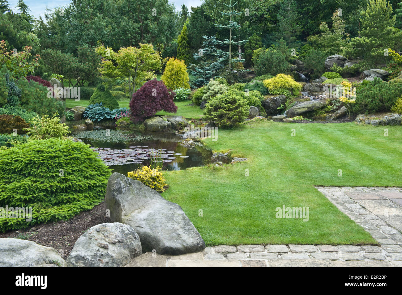 gridstone rock with plants patio and pond in garden design by bahaa seedhom north yorkshire england may - Garden Design Yorkshire gridstone rock with plants patio and pond in garden design by bahaa seedhom north yorkshire england may - Garden Design Yorkshire