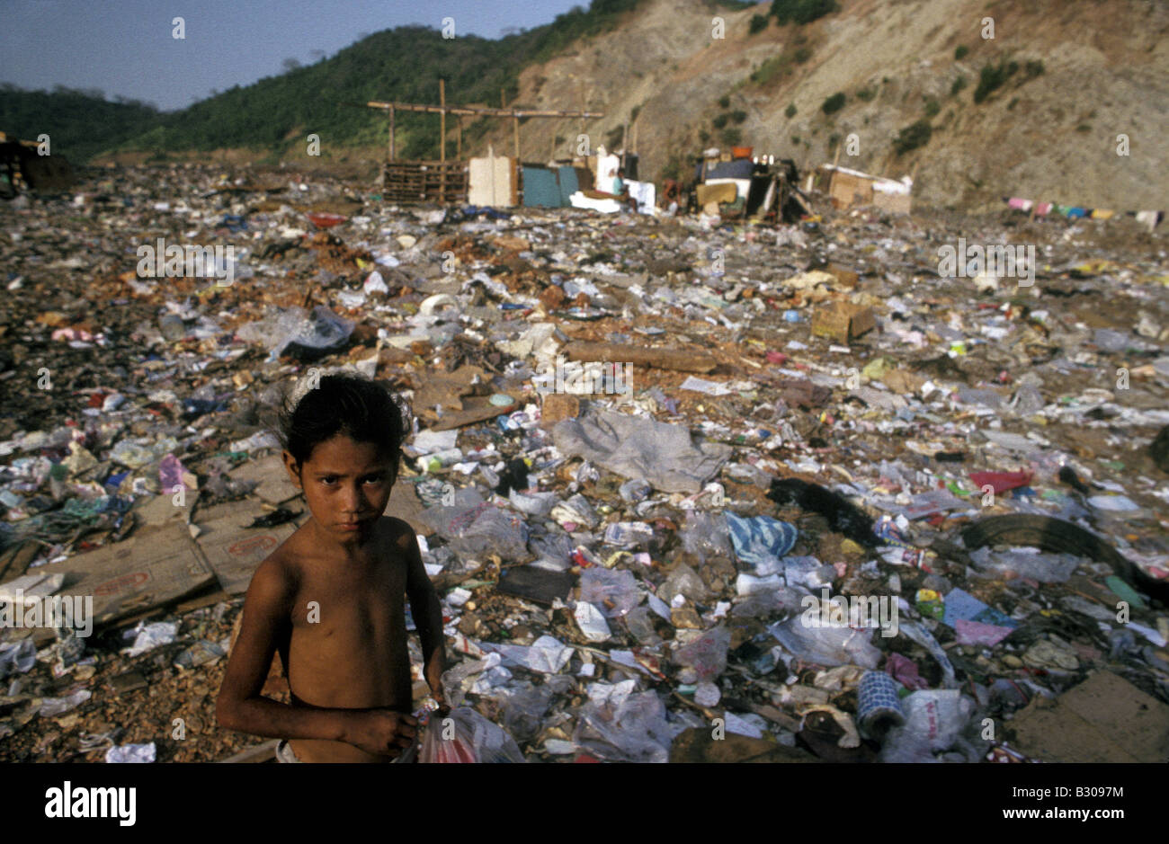 Poverty stricken family forced to live on garbage dump outside Stock