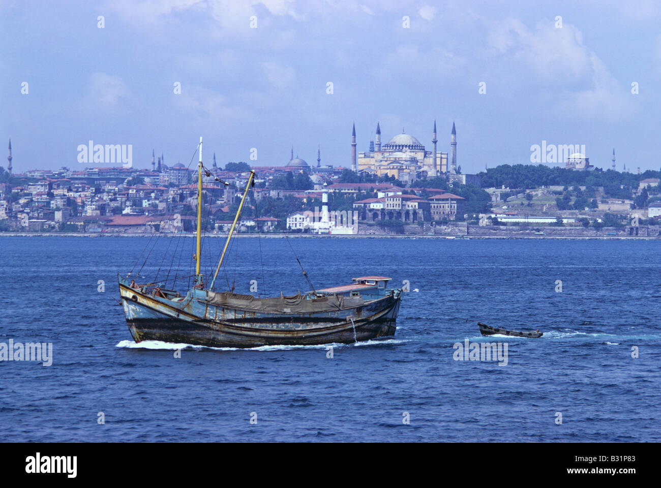 small-boat-in-the-bosphorus-aya-sofya-in-the-background-istanbul-680806-B31P83.jpg
