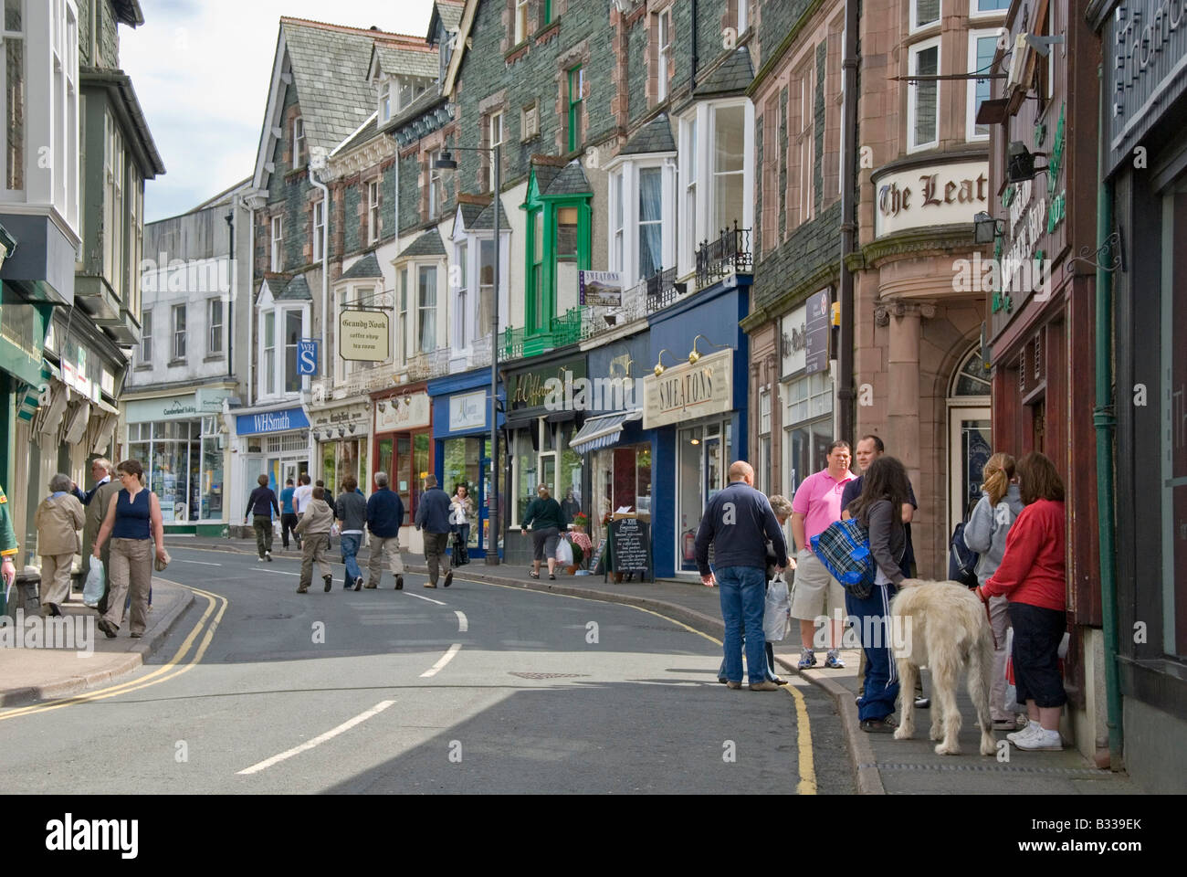 Tourists on a street with shops, Keswick, Lake District, Cumbria Stock Photo, Royalty Free Image